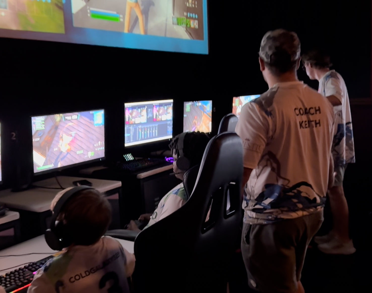 Load video: A video displaying kids walking into a movie theater, playing video games, and a crowd cheering.